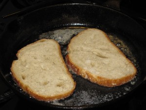 Farm bread in the pan with bacon fat and a little milk